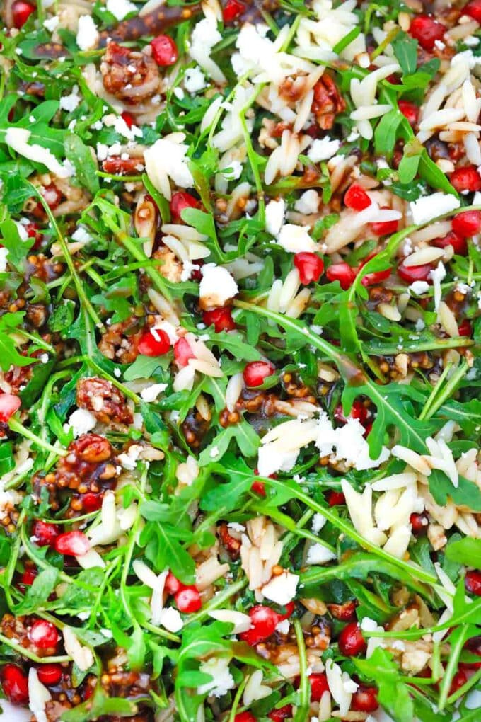 overhead shot if pomegranate orzo salad with feta cheese