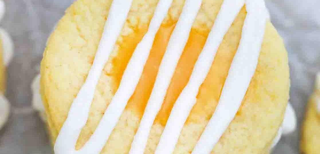 overhead shot of homemade lemon thumbprint cookies topped with glaze