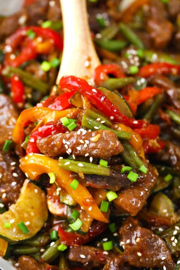 Hunan beef and veggies on a serving spatula.