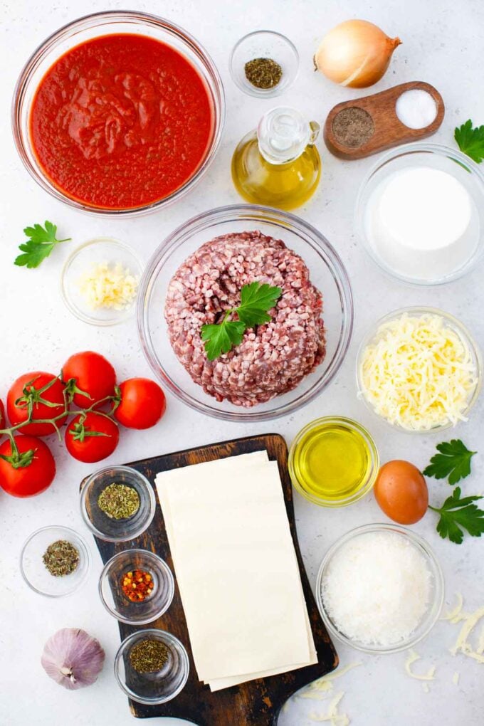 overhead shot of instant pot lasagna ingredients in bowls on a table