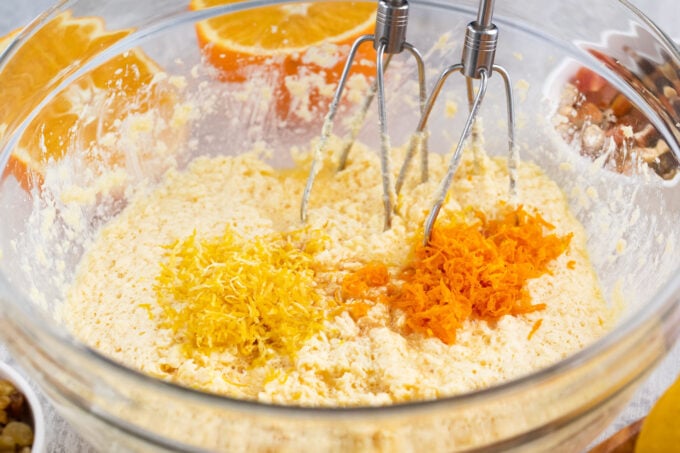 Adding orange and lemon zest into Simnel cake batter.