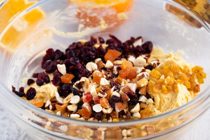 Mixing dried fruits into Simnel cake batter.