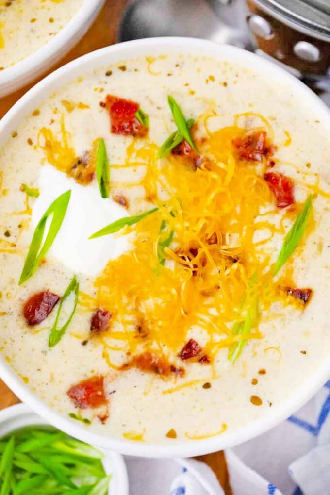 overhead shot of crockpot cheesy potato soup in a bowl