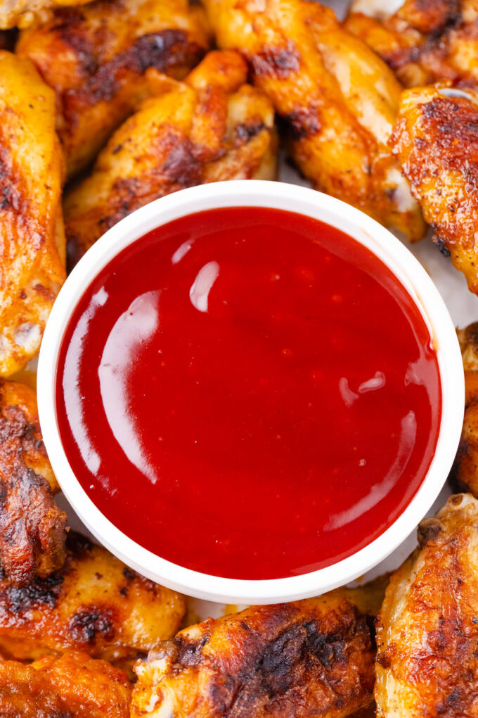 Overhead shot of a dipping bowl with sweet and sour sauce.