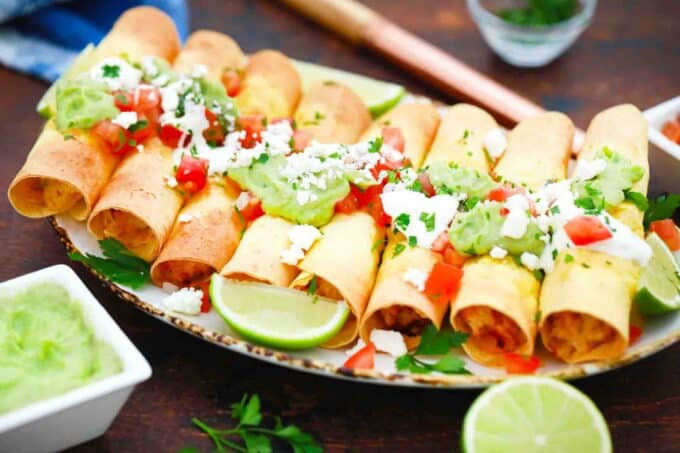 a serving plate with air fryer chicken taquitos