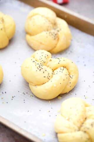sweet bread rolls on a baking sheet