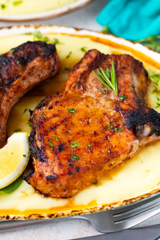 Homemade grilled pork chops served with mashed potatoes.