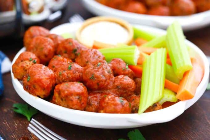 buffalo chicken meatballs served with celery and ranch sauce