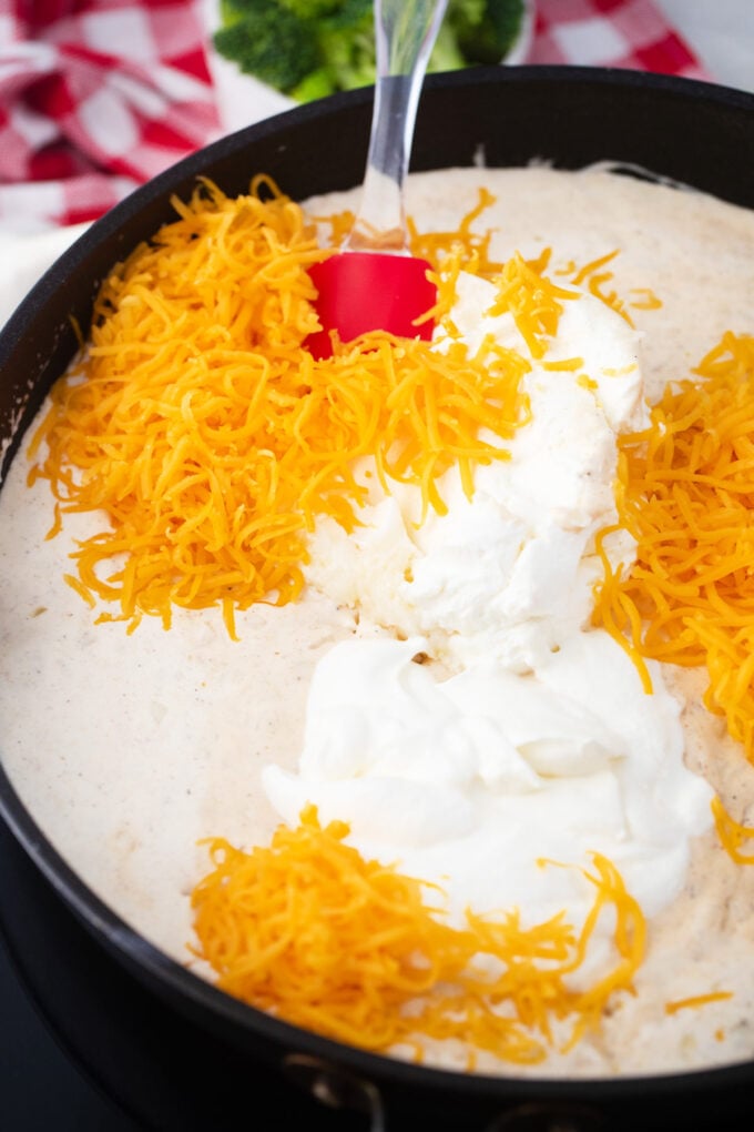 Cheddar cheese sauce in a pan.