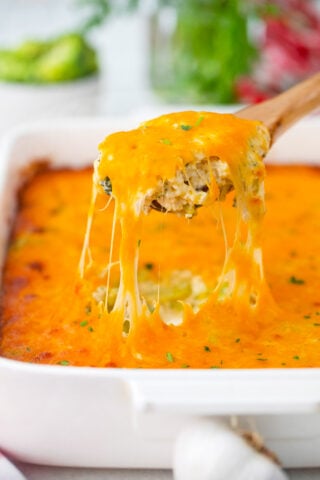 A spoonful of very cheesy broccoli rice casserole.