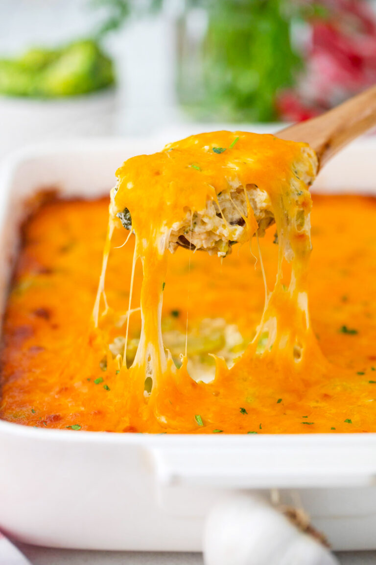 A spoonful of very cheesy broccoli rice casserole.