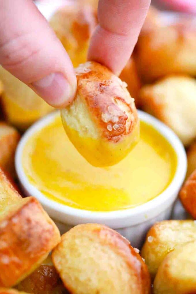 dipping pretzel bites in honey mustard