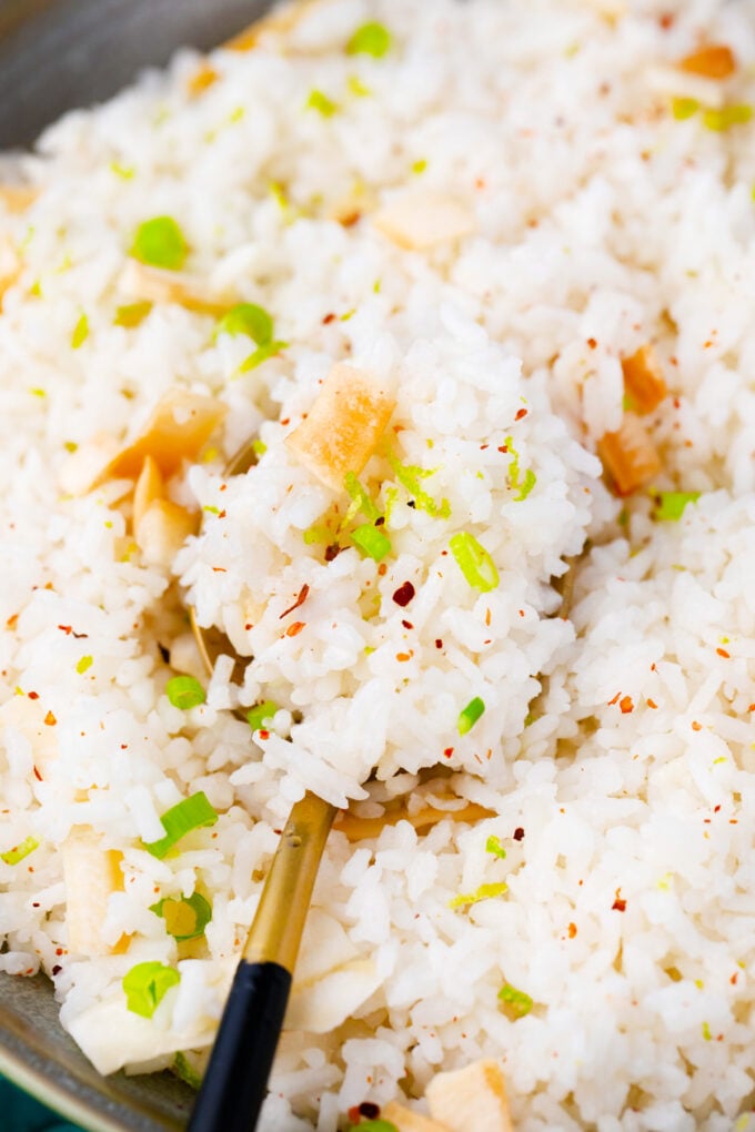 A forkful of coconut rice.