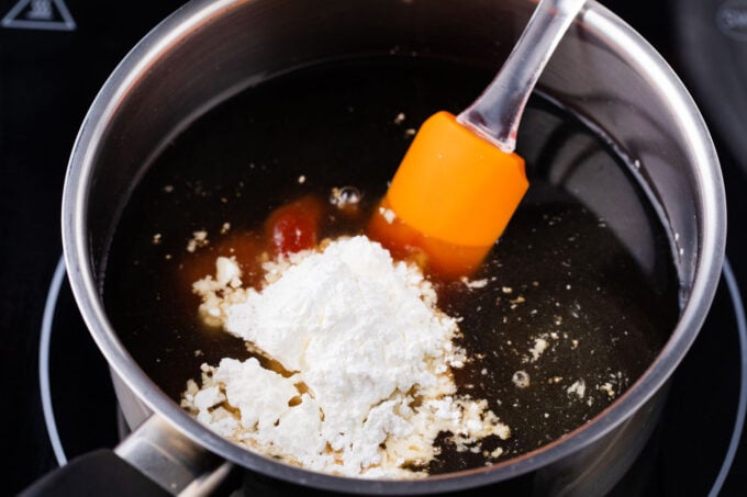 Sweet and sour sauce ingredients in a saucepan.