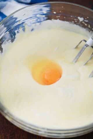 adding eggs to batter mixture