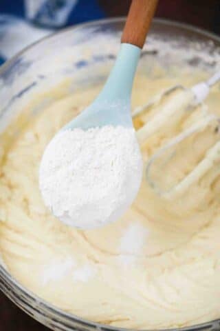 adding flour to batter mixture
