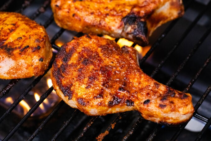 Making juicy grilled pork chops.