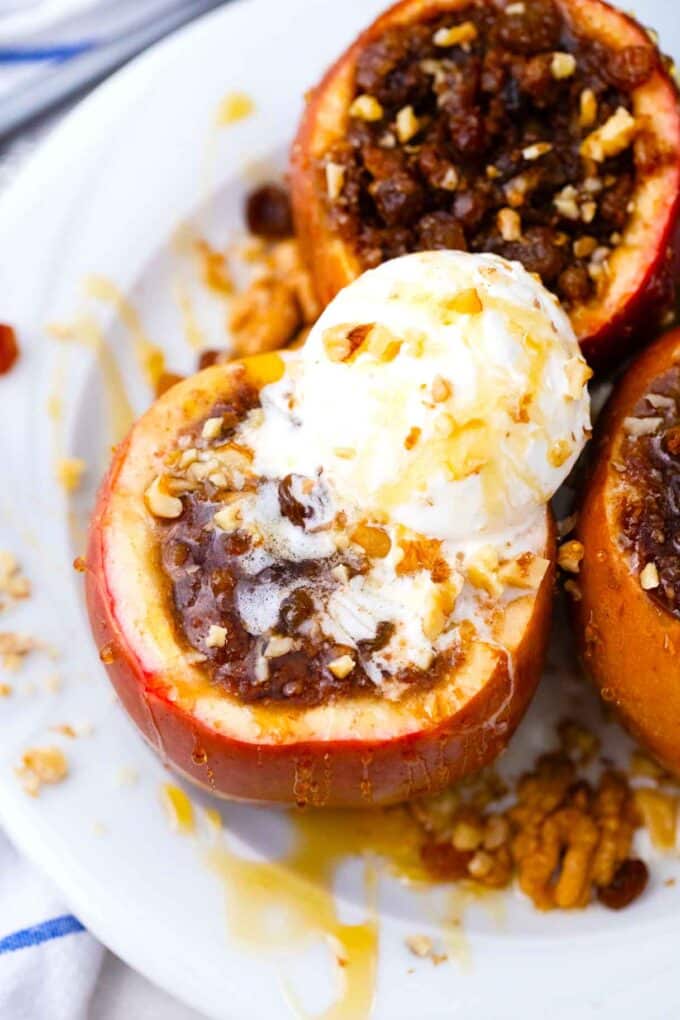 crockpot baked apples topped with a scoop of vanilla ice cream