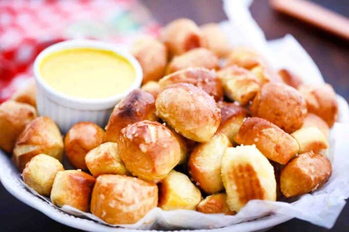 a plate of homemade pretzel bites with dipping sauce