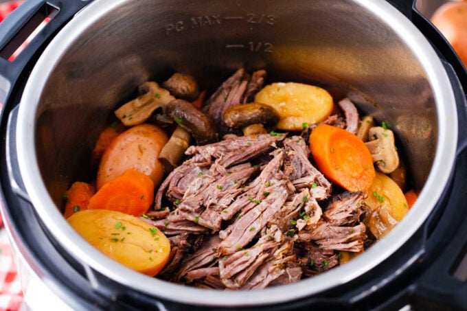 Shredded Instant Pot pot roast with veggies.