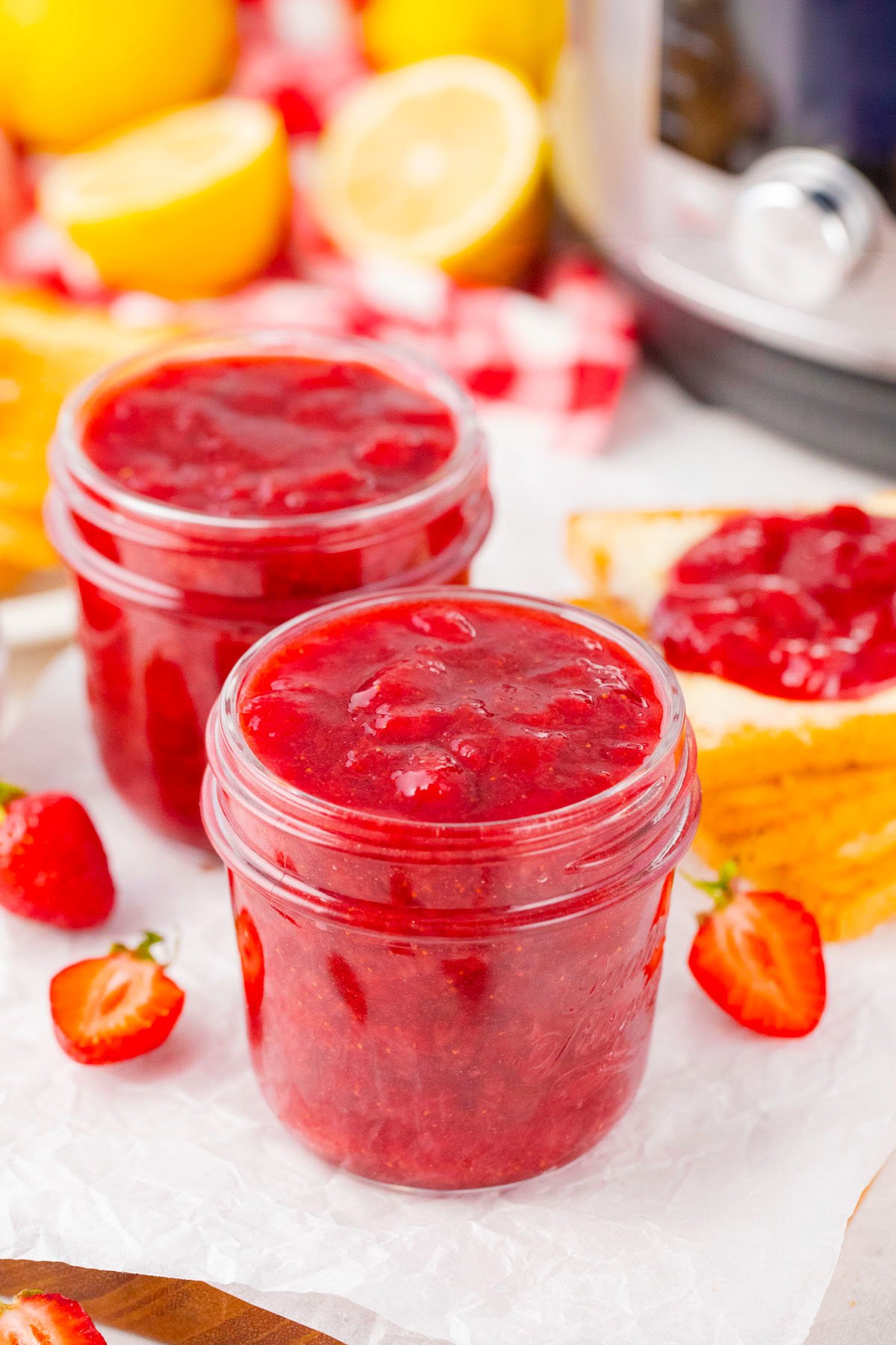 Two jars of homemade instant pot strawberry jam.