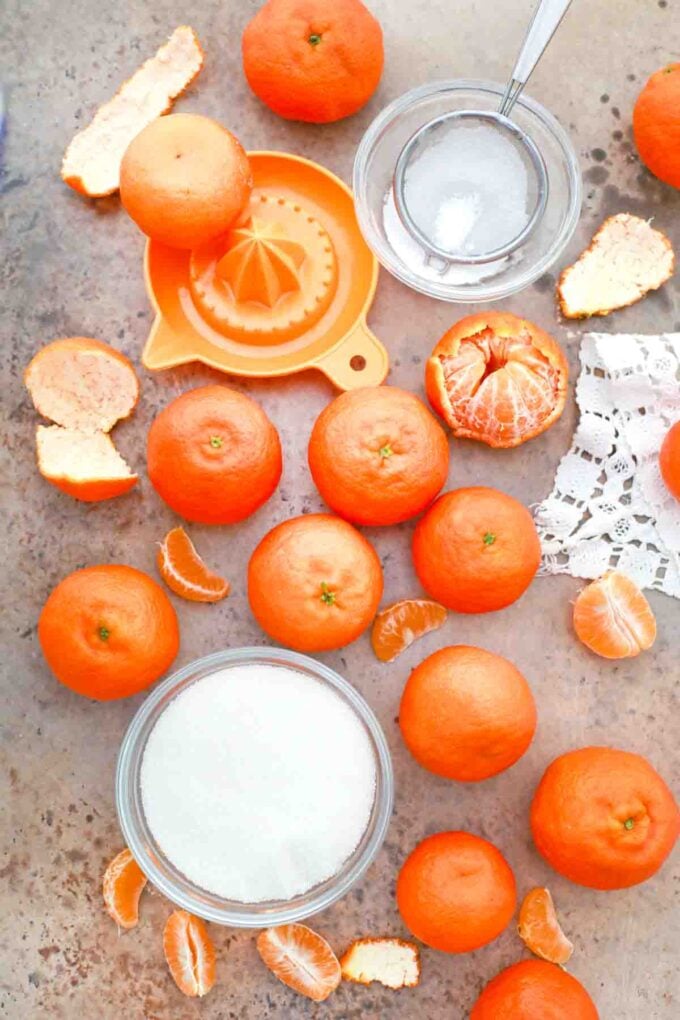 overhead shot of oranges sugar agar agar and water on a table