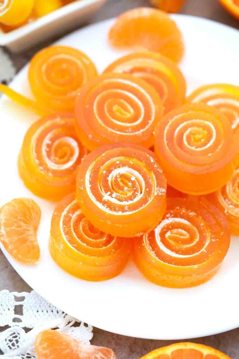 orange jelly candy stacked on a plate