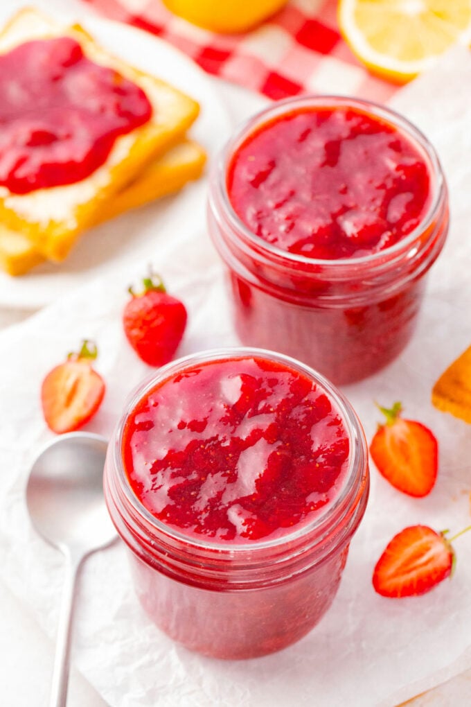 Two jars of homemade pressure cooker strawberry jam.