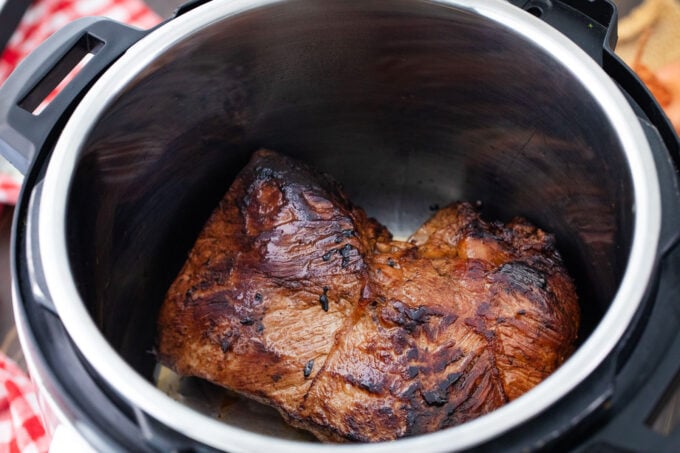Searing a chuck of beef in the Instant Pot.