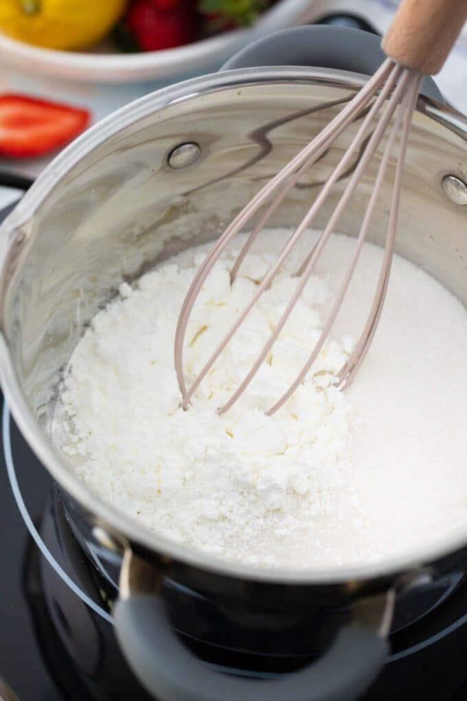 Whisking cornstarch and sugar in a bowl.