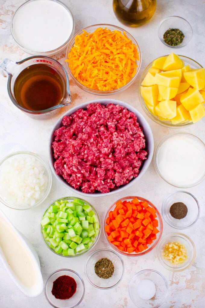 Overhead shot of Instant Pot cheeseburger soup ingredients in bowls.