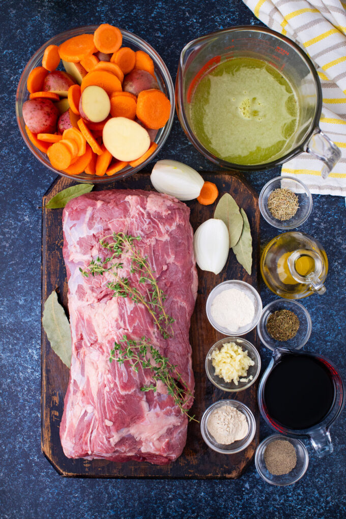 Overhead shot of Instant Pot red wine beef roast ingredients in bowls on a table.