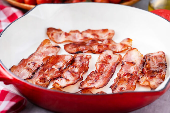 Cooking bacon in a pan.