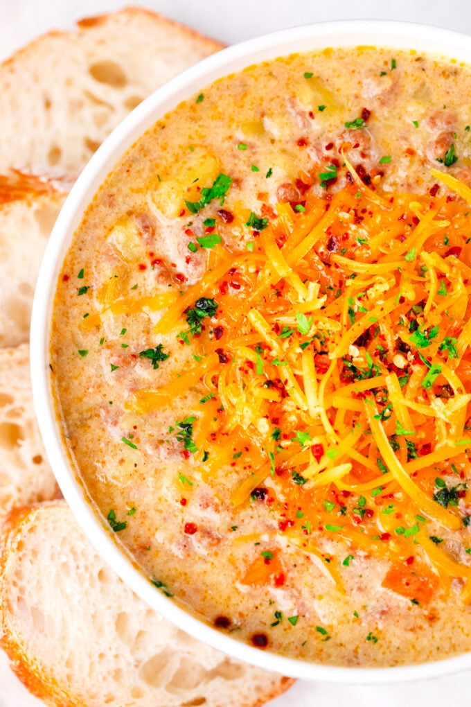 Instant Pot cheeseburger soup topped with shredded cheese.
