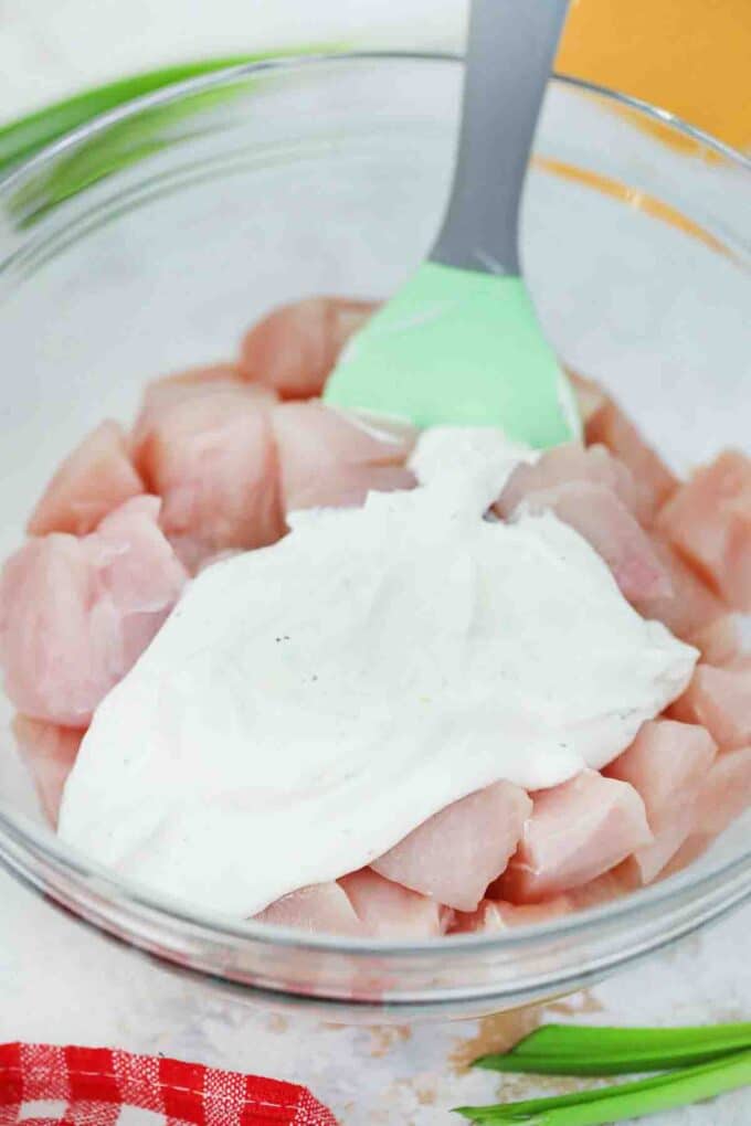 mixing chicken chunks with ranch dressing