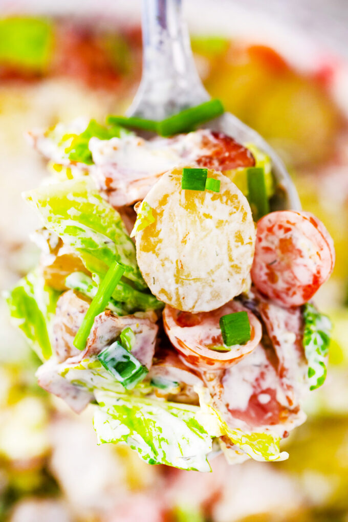 A spoonful of homemade BLT potato salad.