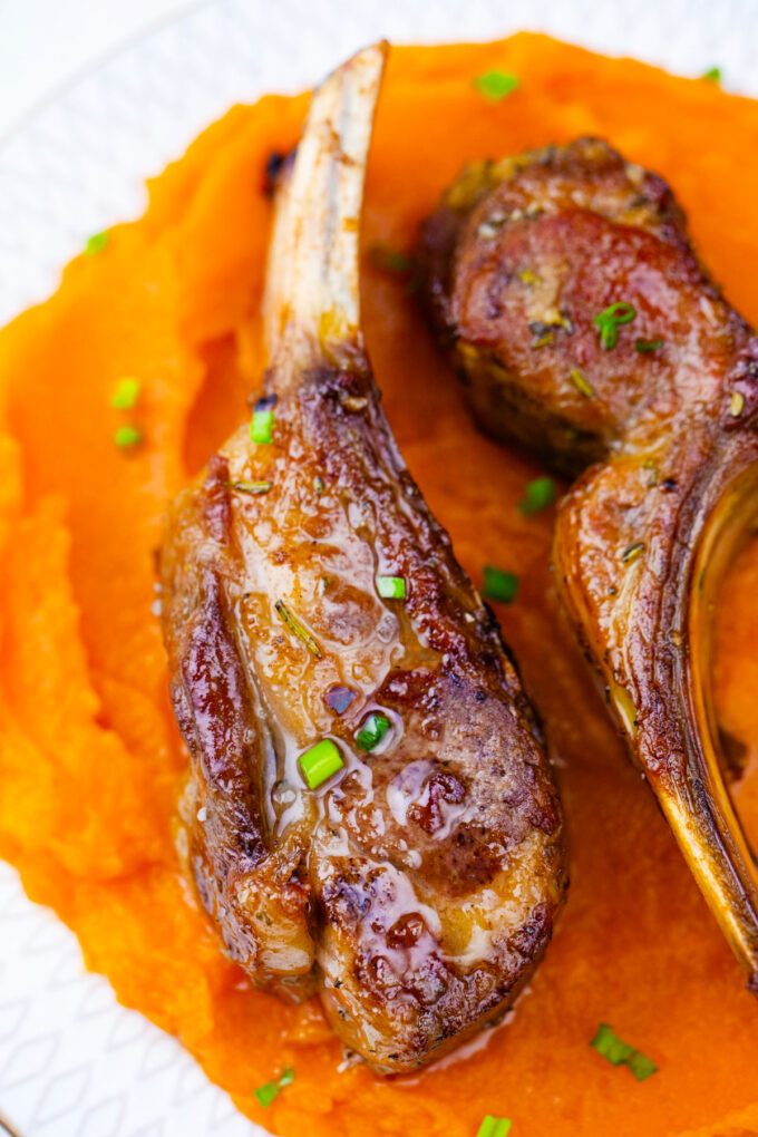 Garlic brown sugar lamb ribs served with mashed sweet potatoes.