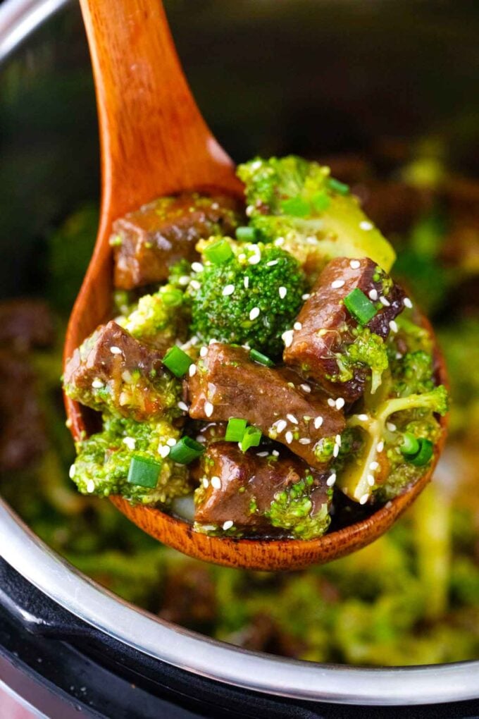 A ladle of perfectly cooked Instant Pot beef and broccoli.