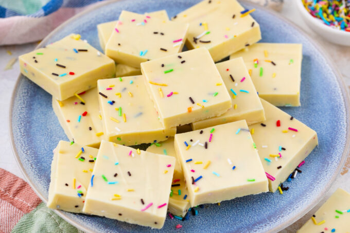 White chocolate fudge squares on a plate.
