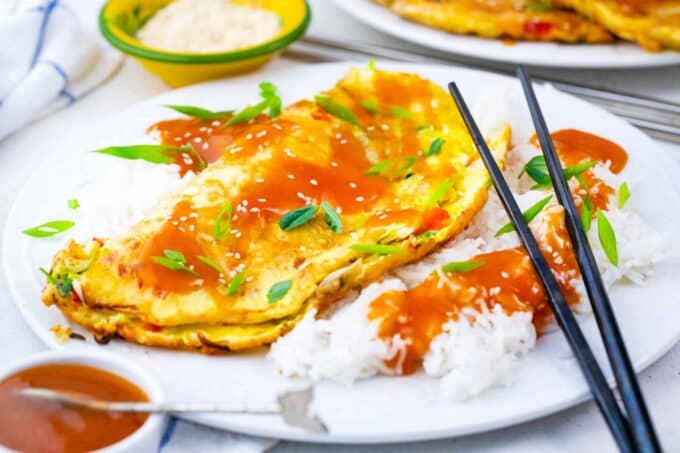 egg foo young omelette with white rice and sauce