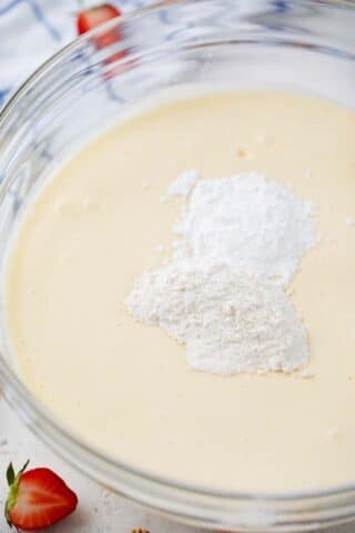 adding flour and cornstarch to cheesecake batter