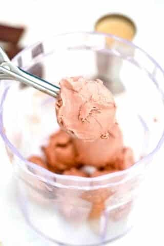 adding chocolate ice cream to a blender