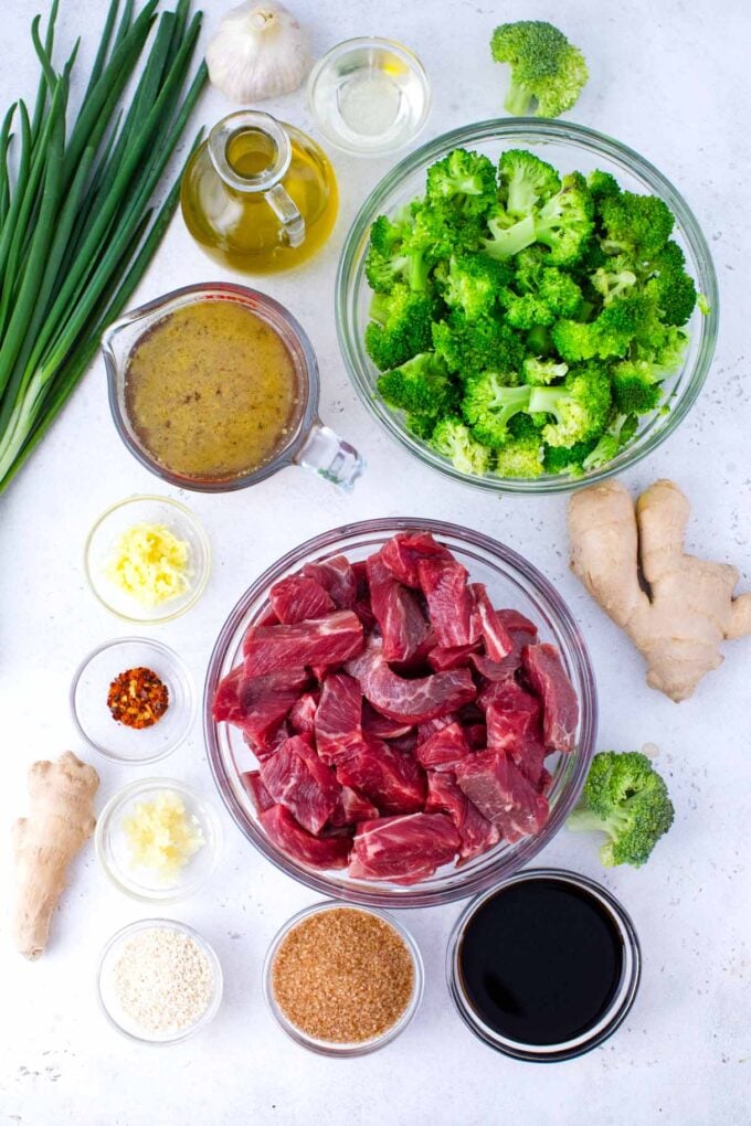Overhead shot of instant pot beef and broccoli ingredients in bowls on a table.