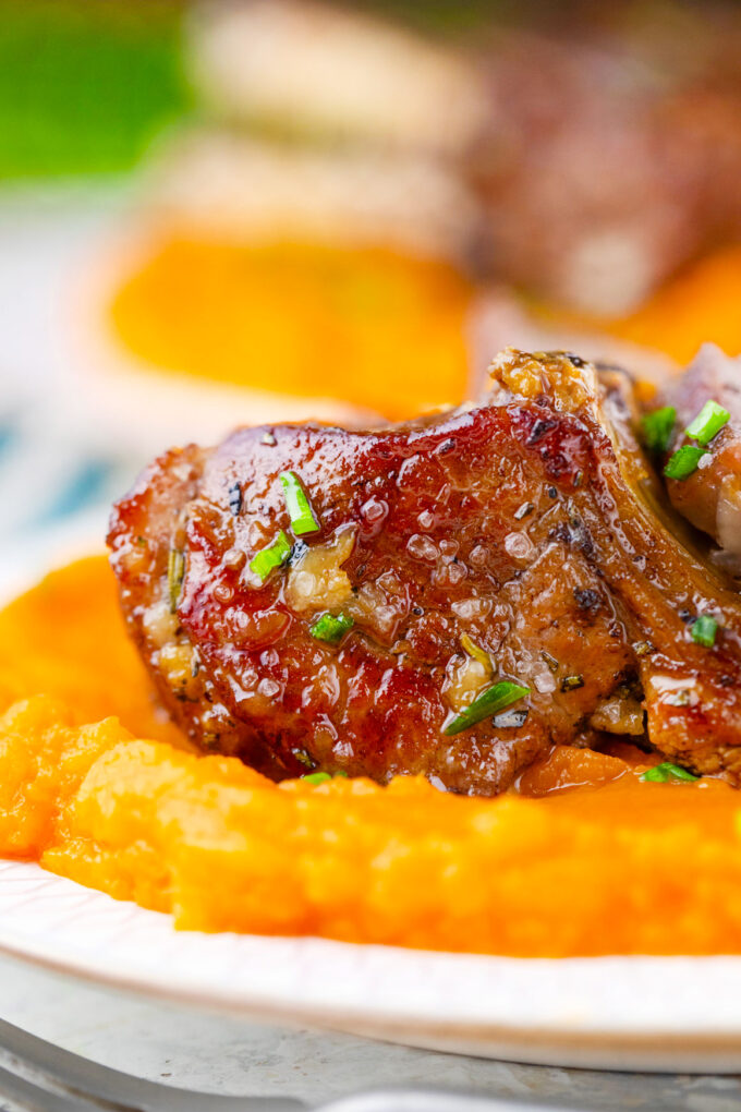 Juicy and tender garlic brown sugar lamb ribs with sweet potatoes.