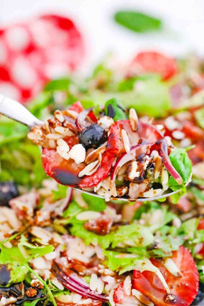 close shot of a spoonful of strawberry orzo spring salad