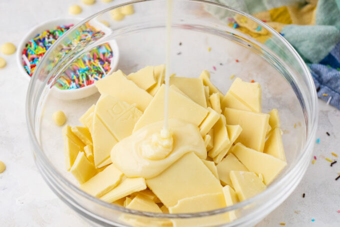 White chocolate and condensed milk in a bowl.