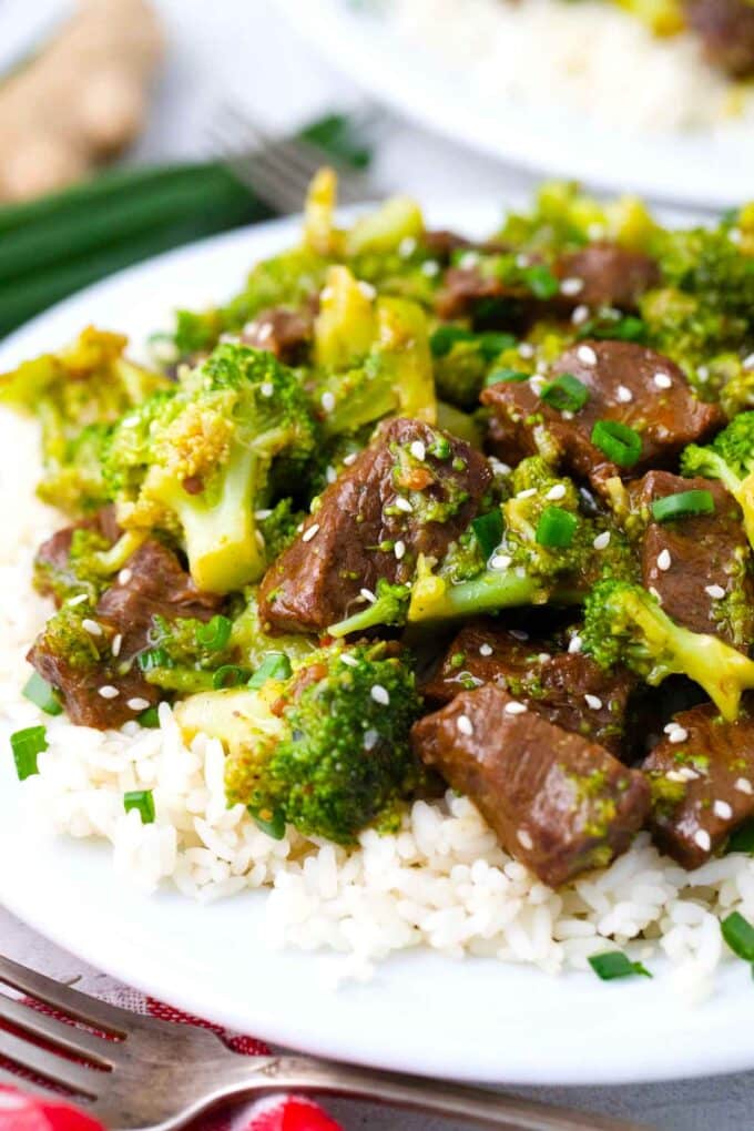 Tender pressure cooker beef and broccoli served on top of rice.
