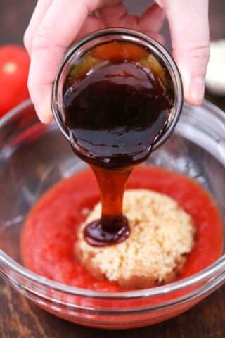 adding molasses to tomato sauce