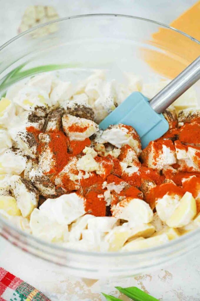 adding spices to ranch potatoes