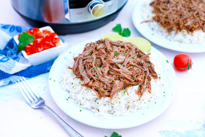 Instant Pot Barbacoa Beef over fluffy white rice.